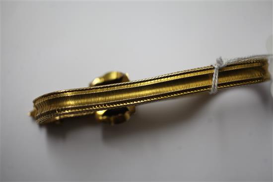 A Victorian gold and garnet snakelink slide action bracelet, gross 18 grams.